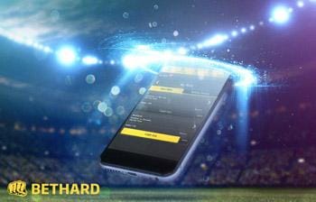 bethard mobiltelefon i en fotbollsarena